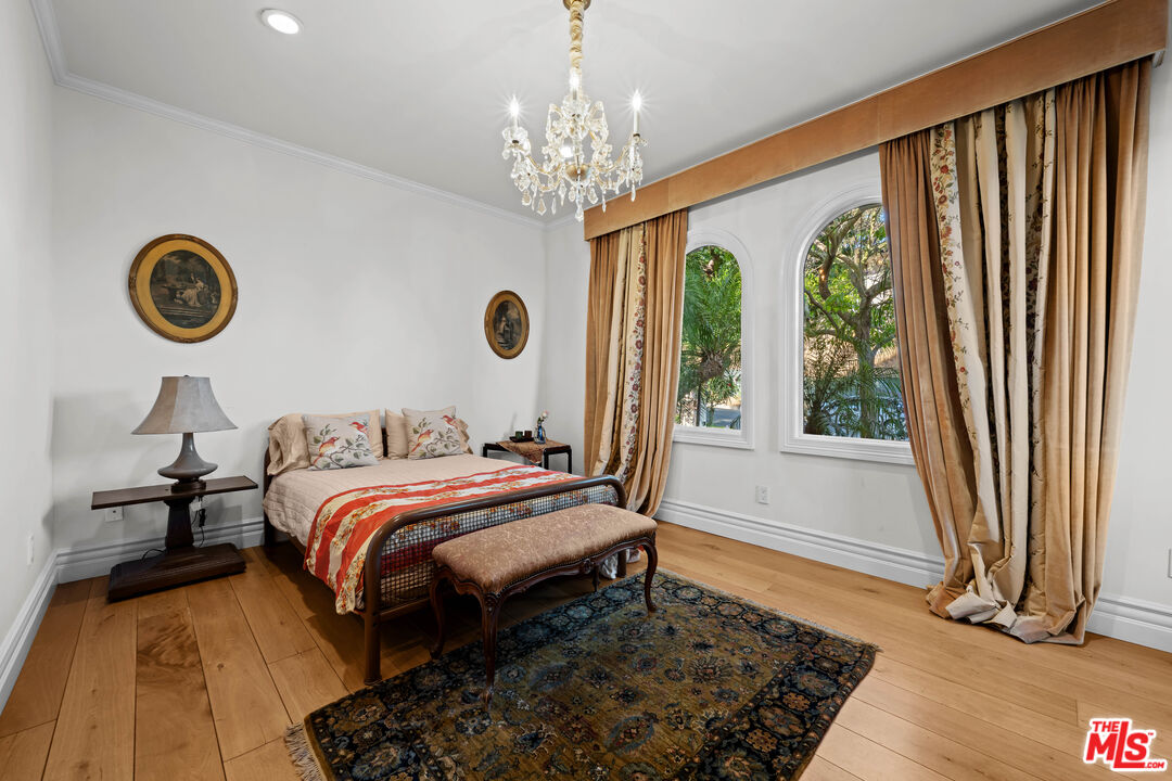 1575 Alexis Place Beverly Hills, CA 90210 - Photo 58 of 75 a bedroom with a bed and a window