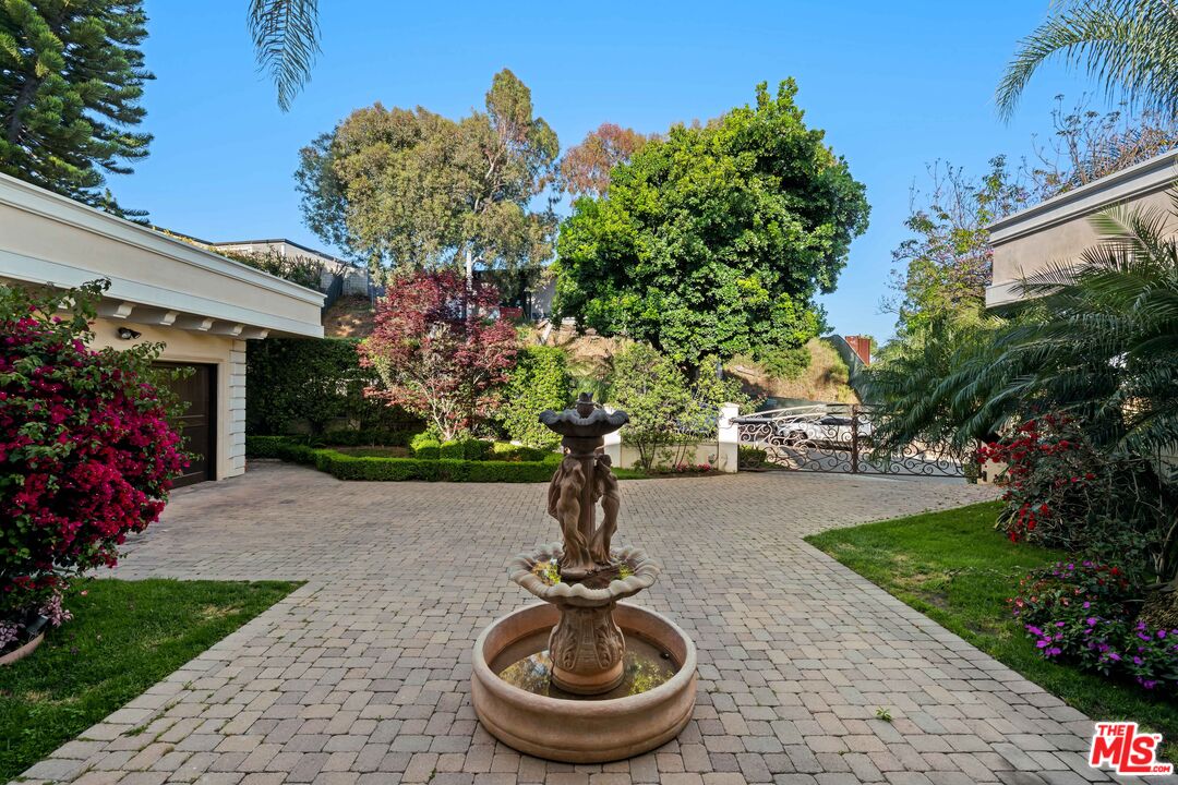 1575 Alexis Place Beverly Hills, CA 90210 - Photo 66 of 75 a front view of a house with garden
