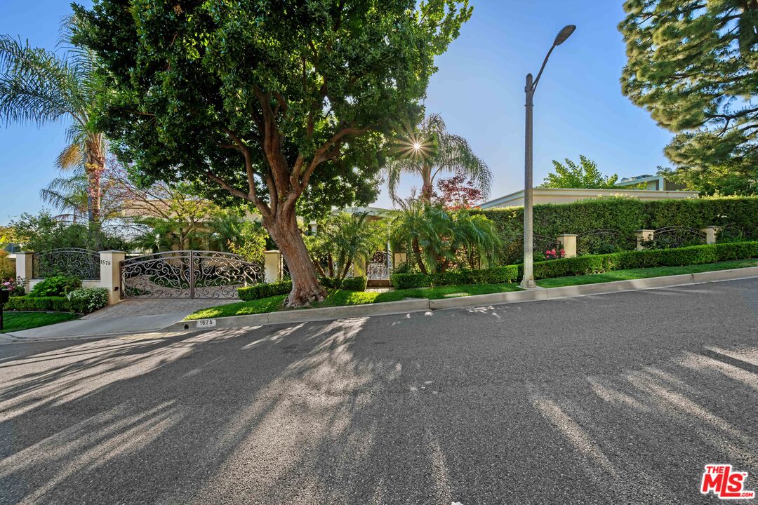 1575 Alexis Place Beverly Hills, CA 90210 - Photo 70 of 75 a view of a street with a building in the background