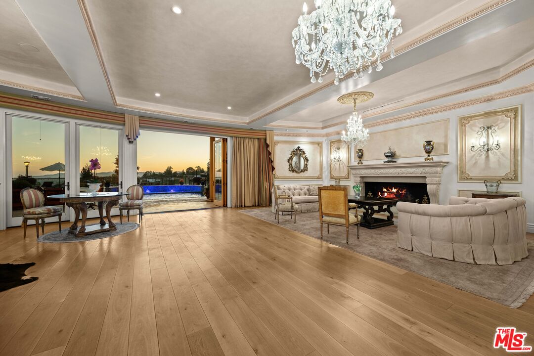 1575 Alexis Place Beverly Hills, CA 90210 - Photo 8 of 75 a living room with furniture and a fireplace