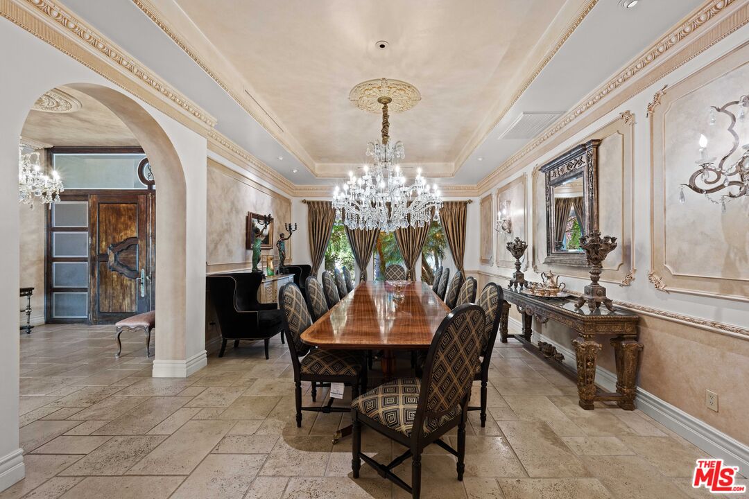 1575 Alexis Place Beverly Hills, CA 90210 - Photo 9 of 75 a view of a dining room with furniture and chandelier