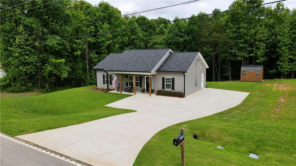 1776 Pleasant Grove Road Temple, GA 30179 - Photo 4 of 45 a aerial view of a house with a yard