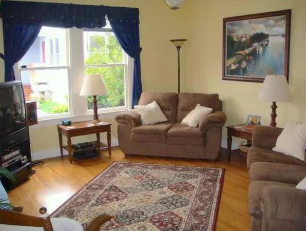 a living room with furniture and a table