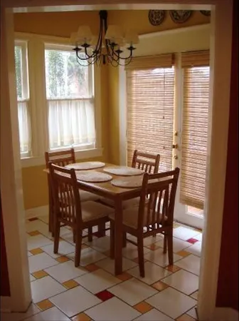 a view of a dining room with furniture and windows