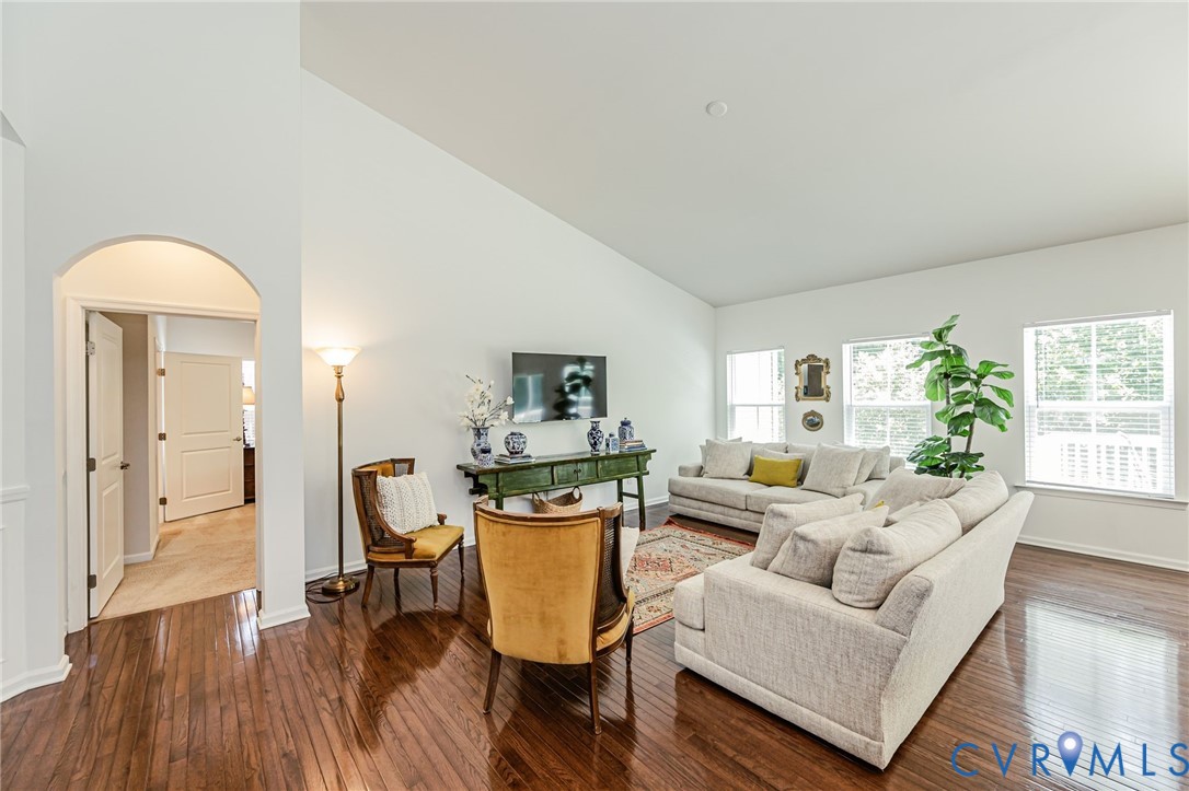 7435 Wicks Road Williamsburg, VA 23188 - Photo 16 of 82 Spacious living area featuring rich wood-finish fl