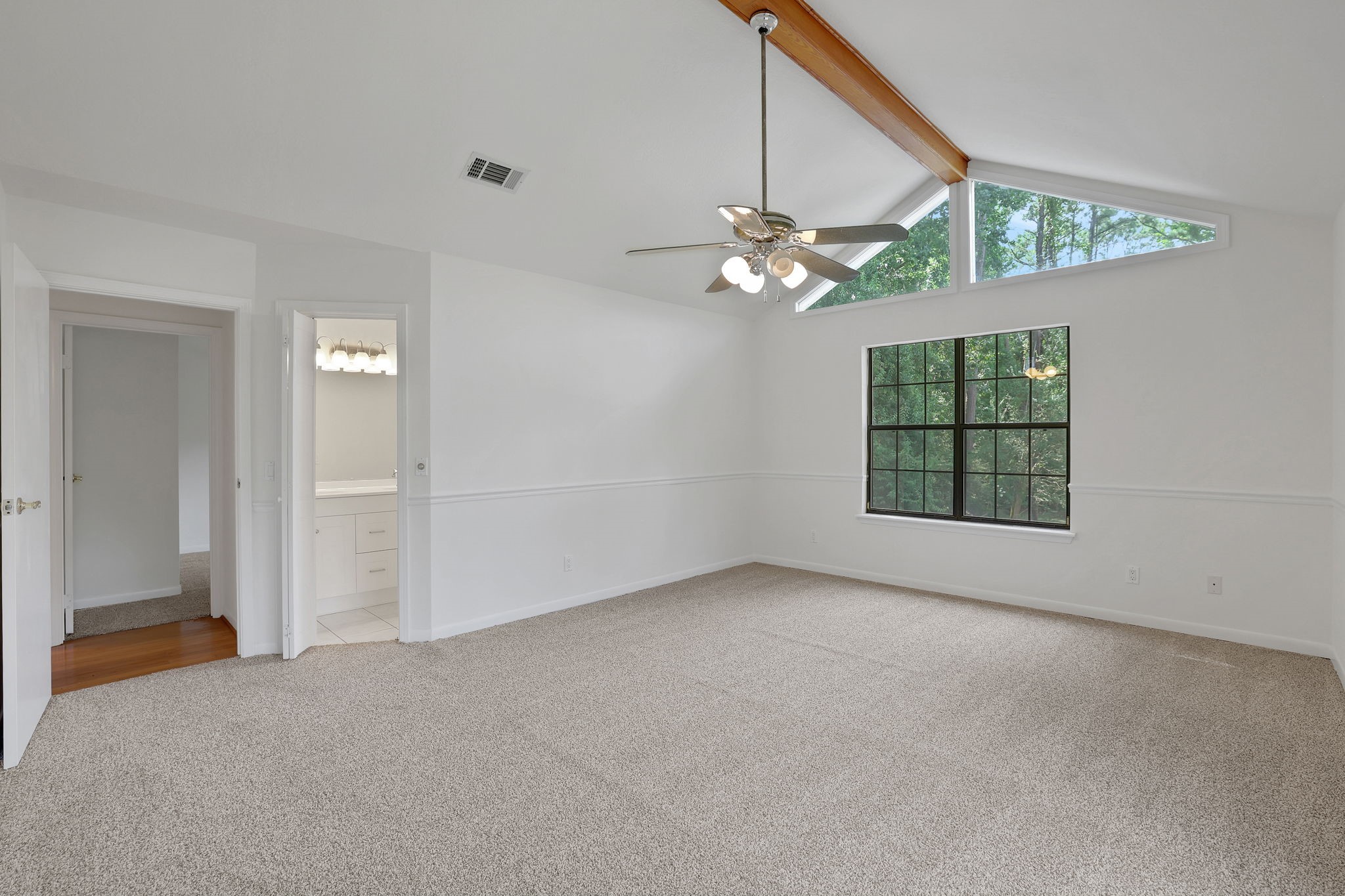 200 Johnson Road Coldspring, TX 77331 - Photo 23 of 47 The primary bedroom features cathedral ceilings and en-suite bathroom