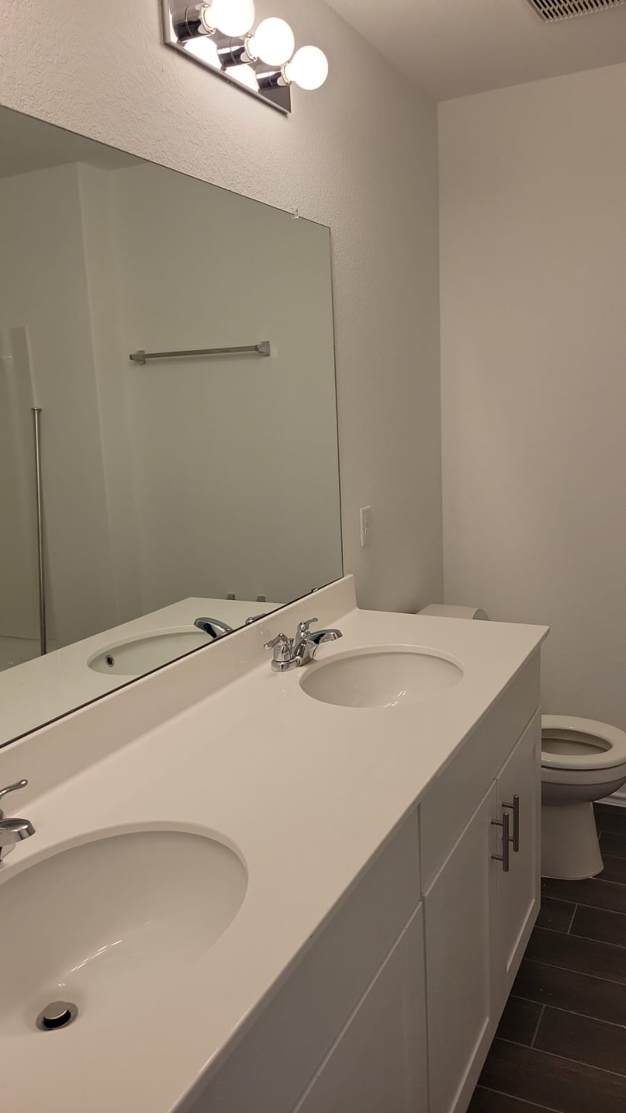 541 Pickrell Loop Georgetown, TX 78628 - Photo 19 of 32 Bathroom featuring a dual vanity with white countertops, white cabinetry, and undermount sinks