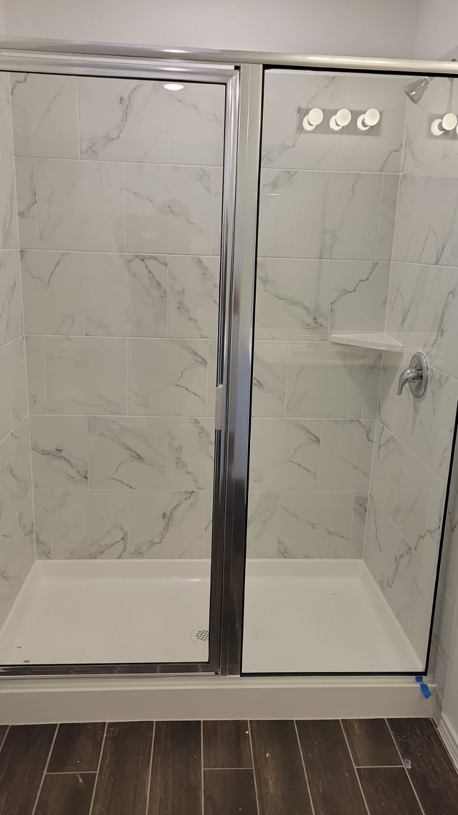 541 Pickrell Loop Georgetown, TX 78628 - Photo 32 of 32 Spacious shower enclosure with marble-style tiling and a built-in shelf