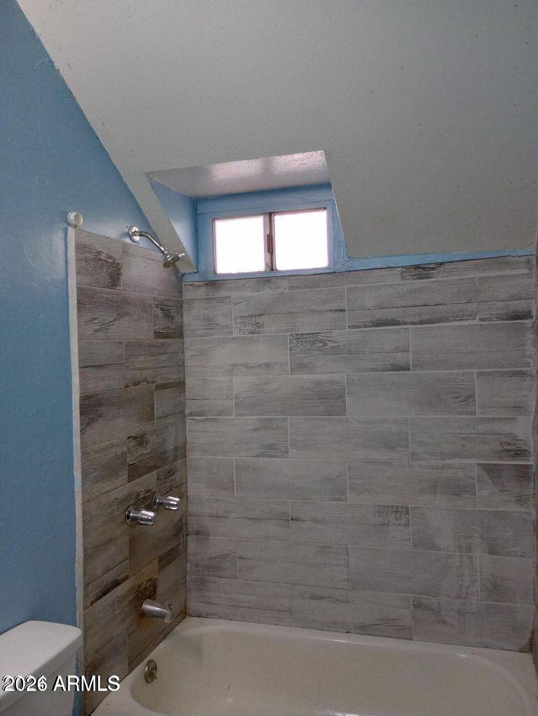 1333 West Taylor Street Phoenix, AZ 85007 - Photo 3 of 6 a bathroom with a bathtub and shower