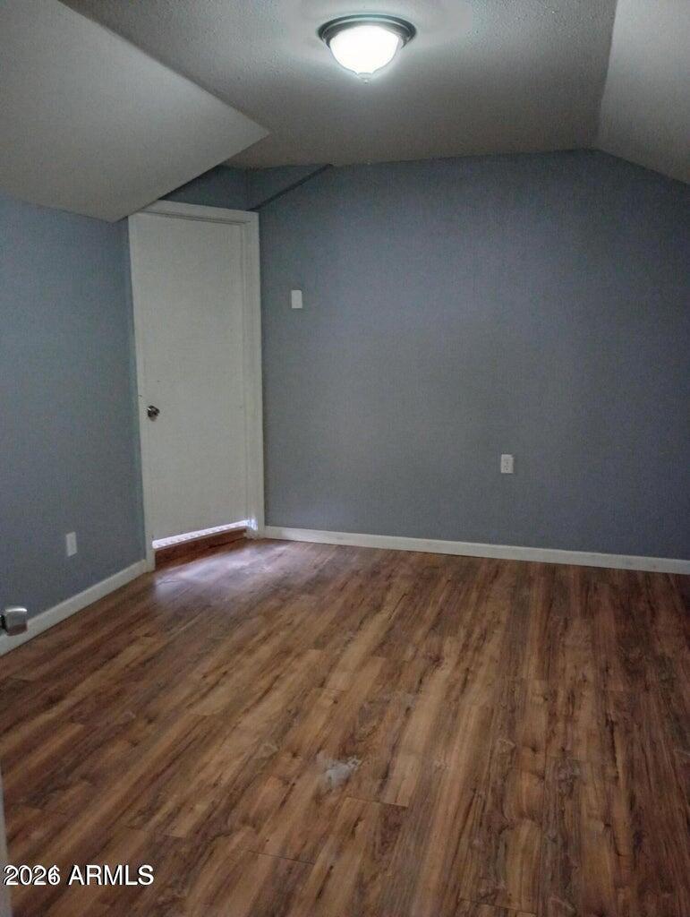 1333 West Taylor Street Phoenix, AZ 85007 - Photo 4 of 6 a view of an empty room and wooden floor