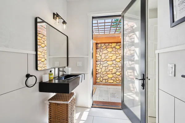a bathroom with a tub and a window