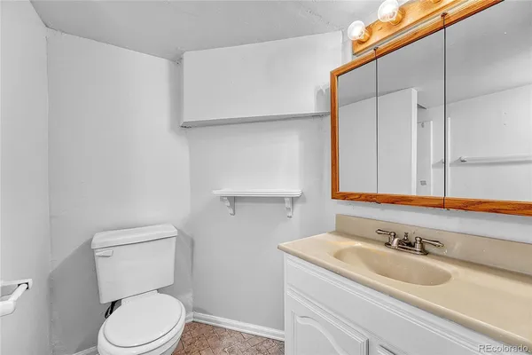 a bathroom with a sink and a toilet