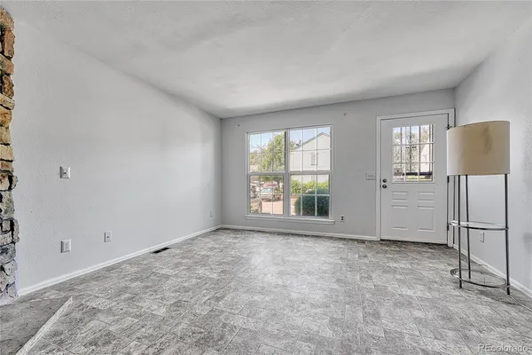 a view of an empty room with a window