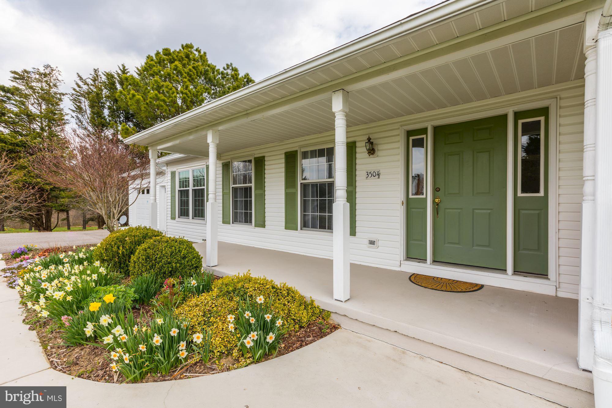 3504 Cedars Stable Road Davidsonville, MD 21035 - Photo 2 of 24 Welcoming Front Porch surrounded by flowers