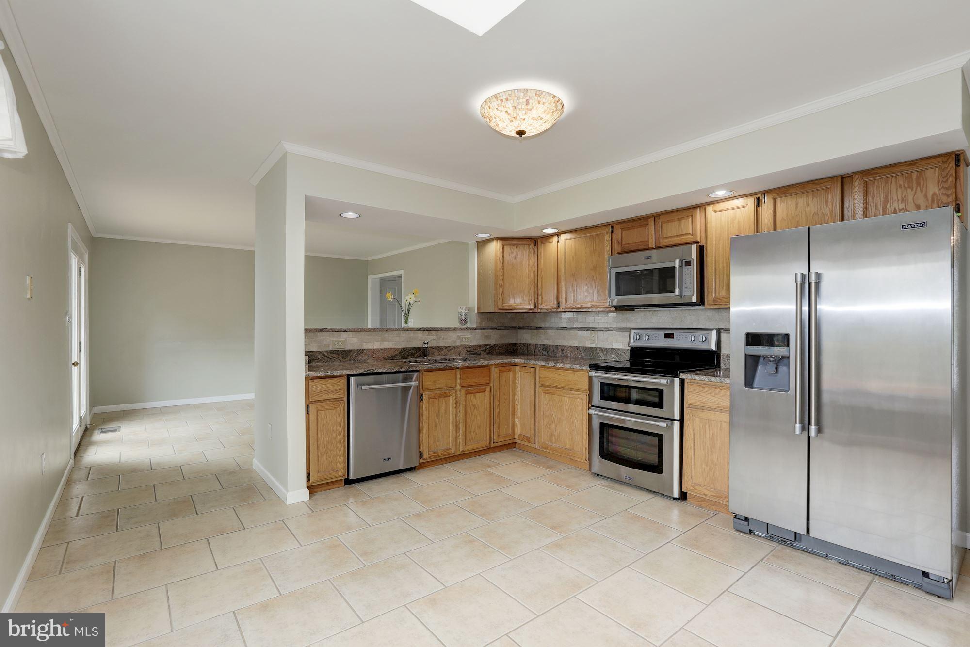 3504 Cedars Stable Road Davidsonville, MD 21035 - Photo 7 of 24 With granite counters, Maytag appliances, pantry