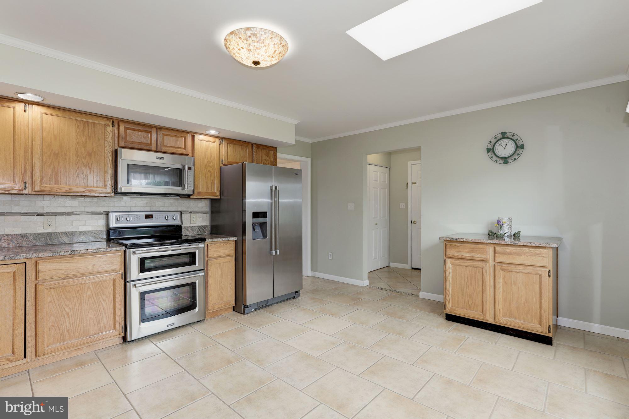 3504 Cedars Stable Road Davidsonville, MD 21035 - Photo 9 of 24 With tile floor, granite counters and pantry