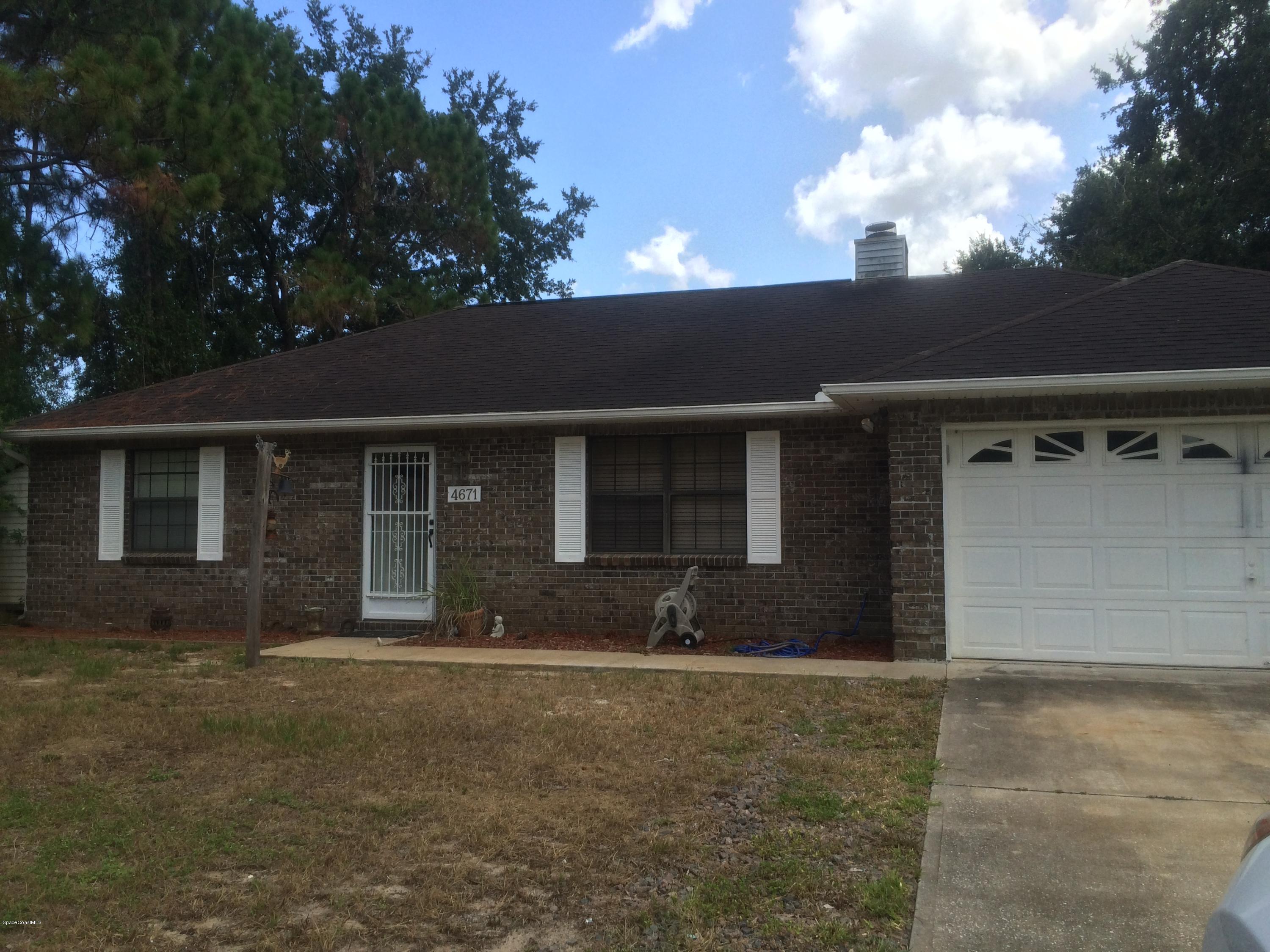 4671 Alfred Street Cocoa, FL 32927 - Photo 1 of 19 front view of a house with a yard