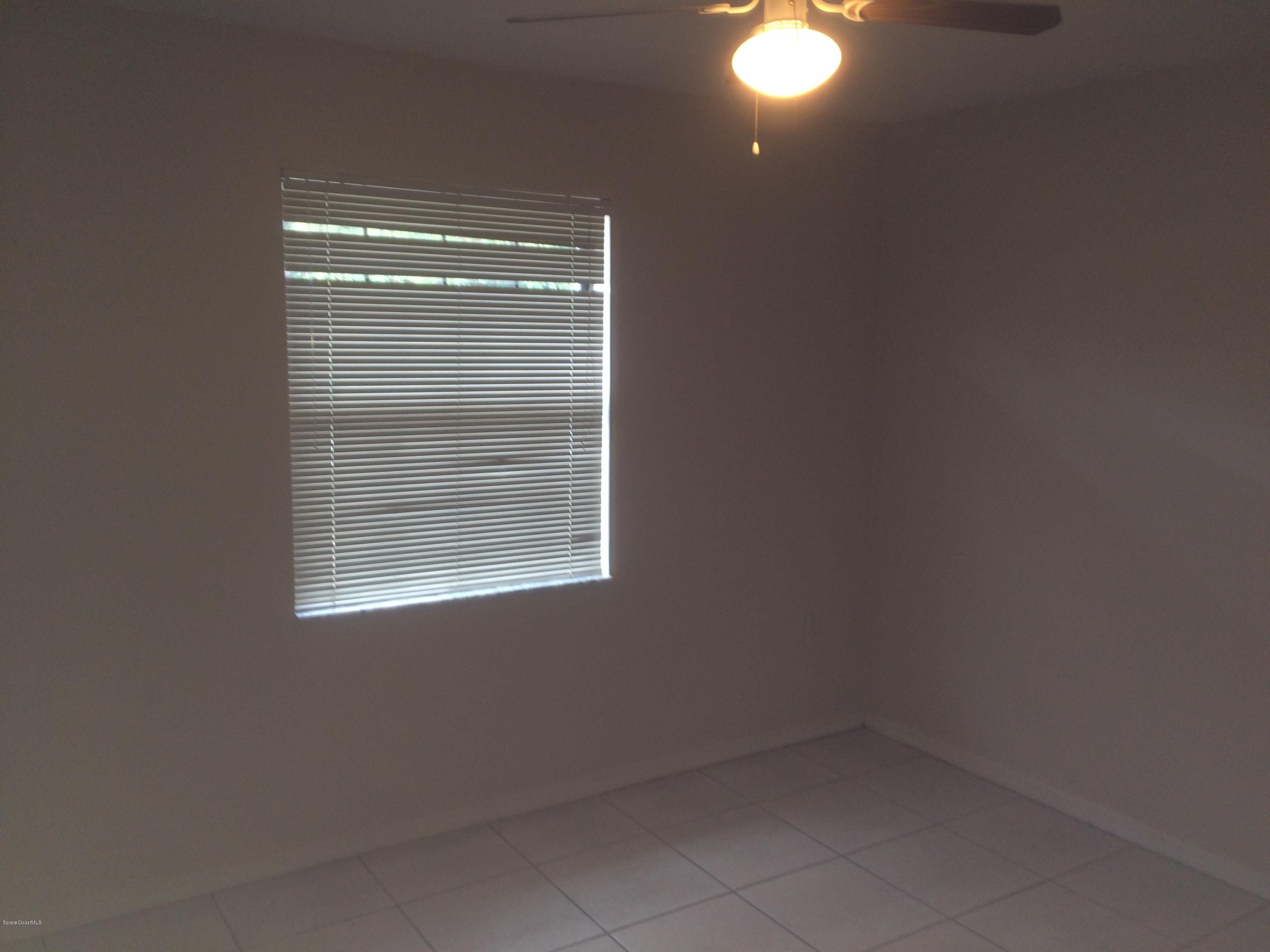 4671 Alfred Street Cocoa, FL 32927 - Photo 11 of 19 a room that has a window in it