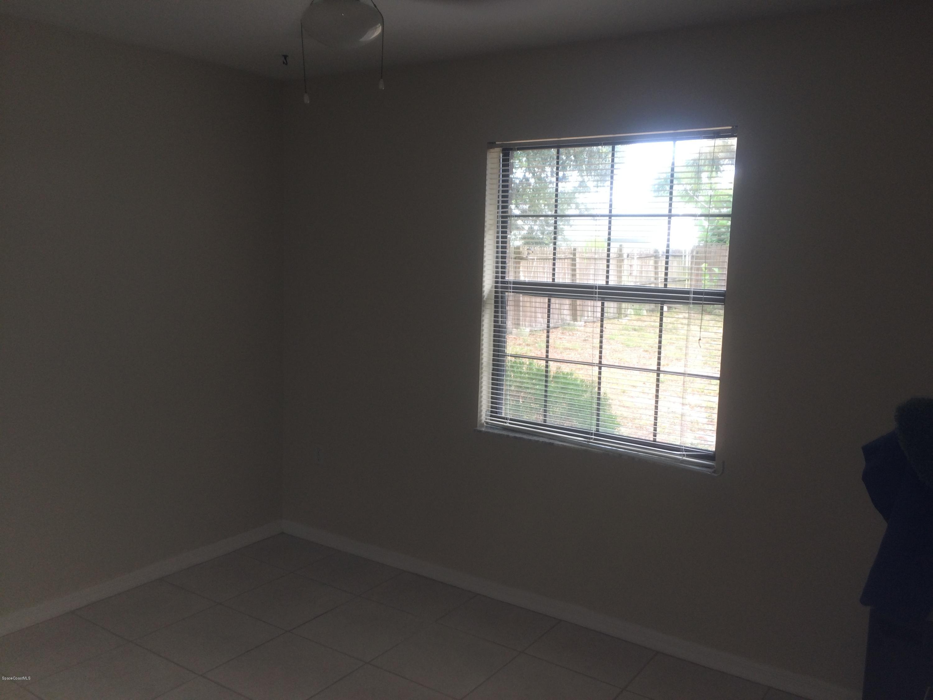 4671 Alfred Street Cocoa, FL 32927 - Photo 14 of 19 an empty room with a window