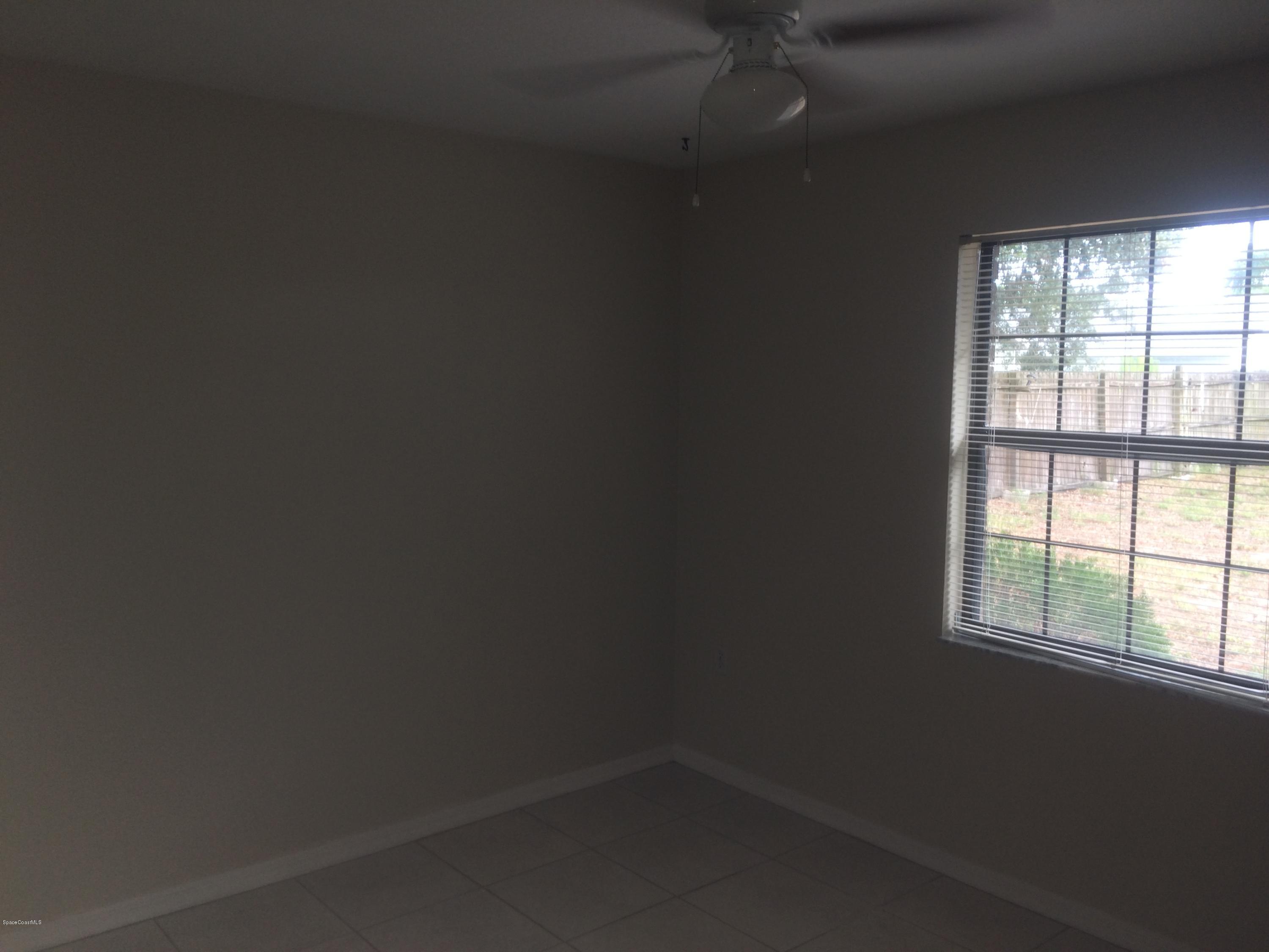 4671 Alfred Street Cocoa, FL 32927 - Photo 15 of 19 an empty room with a window