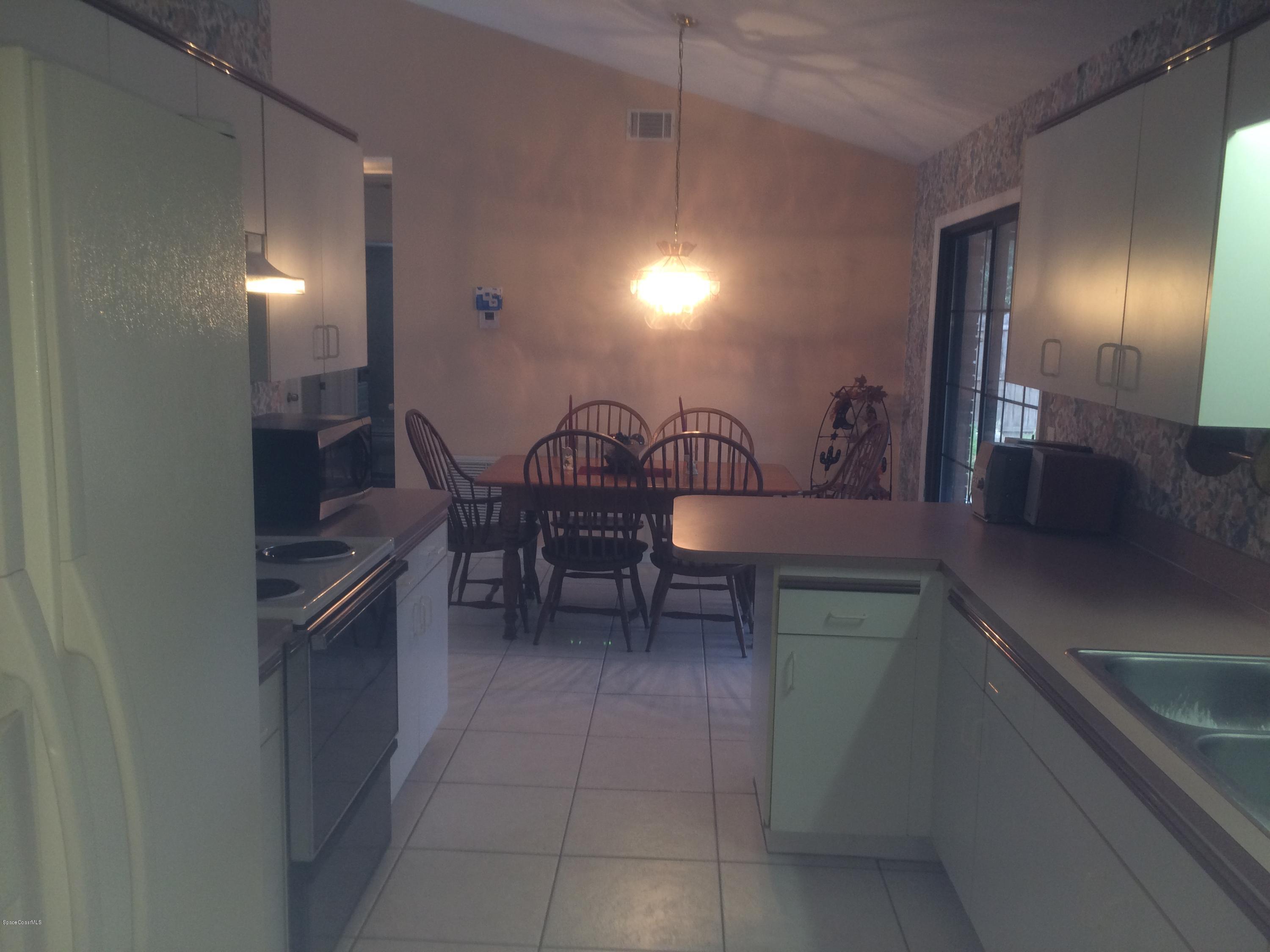 4671 Alfred Street Cocoa, FL 32927 - Photo 6 of 19 a kitchen with a sink and cabinets