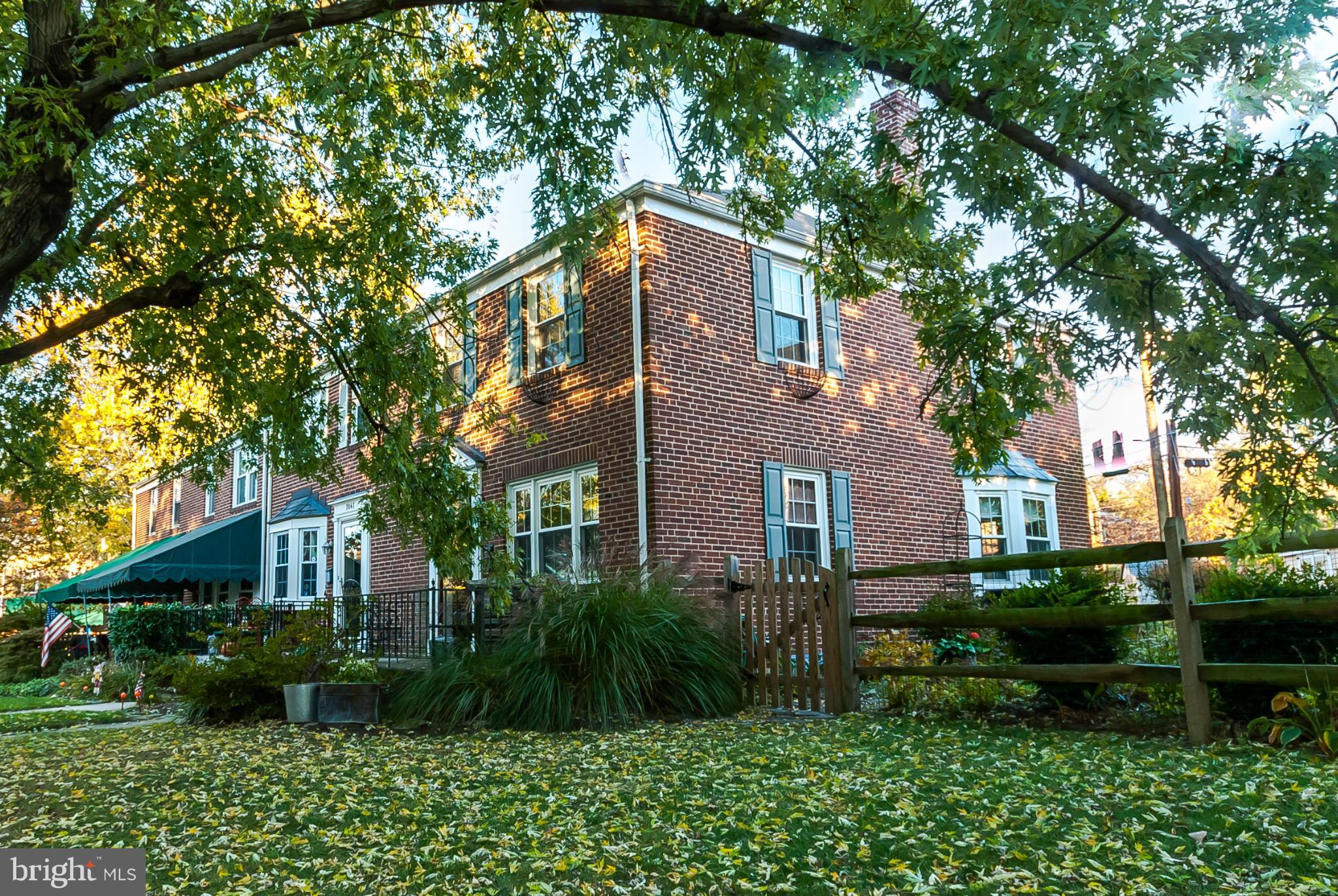 7045 Heathfield Road Baltimore, MD 21212 - Photo 2 of 27 a front view of a house with a yard and potted plants