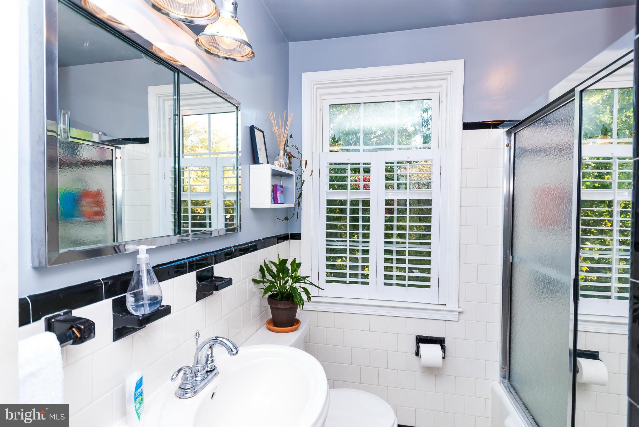 7045 Heathfield Road Baltimore, MD 21212 - Photo 13 of 27 a bathroom with a sink and a mirror