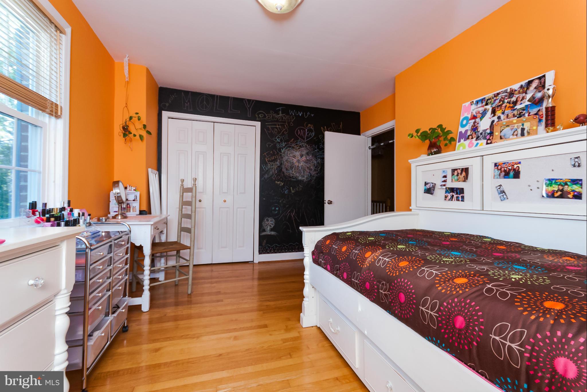 7045 Heathfield Road Baltimore, MD 21212 - Photo 16 of 27 a bed room with a bed and a chair
