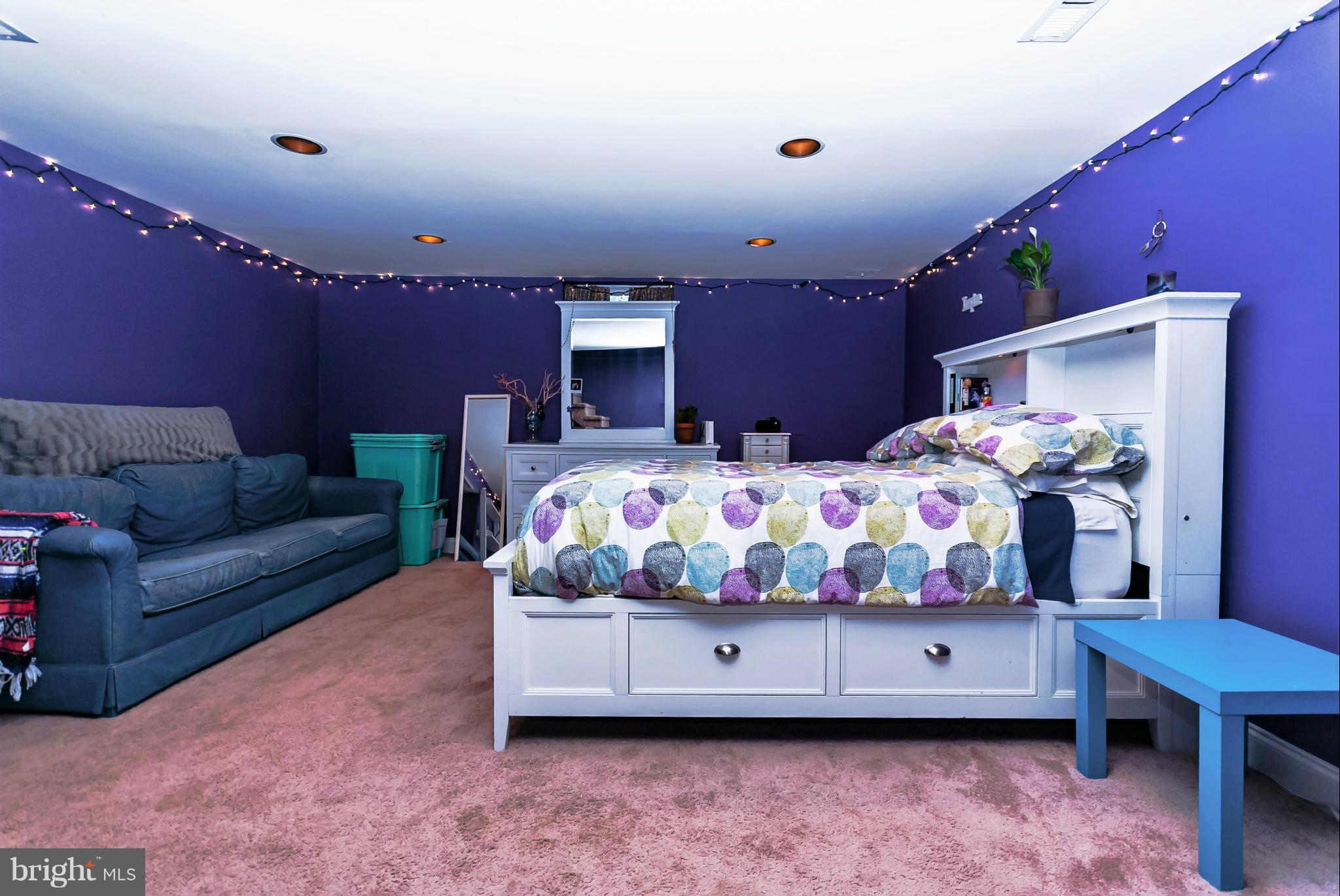 7045 Heathfield Road Baltimore, MD 21212 - Photo 21 of 27 a bedroom with furniture and a wooden floor