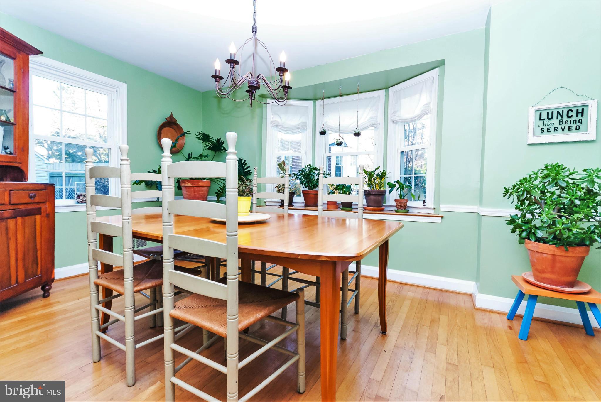 7045 Heathfield Road Baltimore, MD 21212 - Photo 7 of 27 a dining room with furniture window and wooden floor