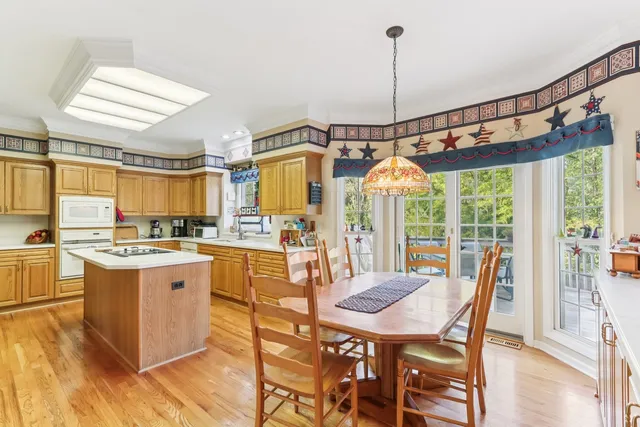 a kitchen with stainless steel appliances granite countertop a stove and refrigerator