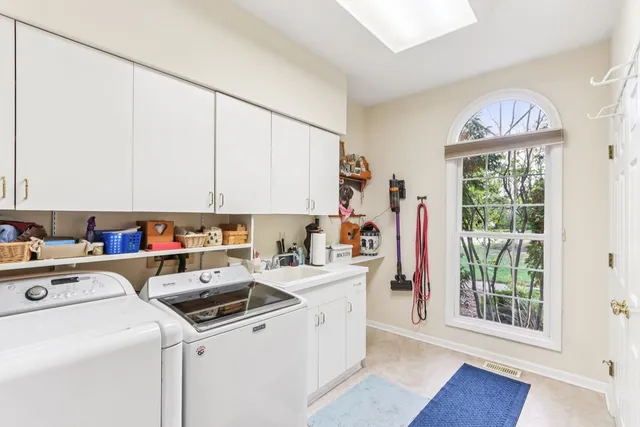 a view of storage and utility room with washer and dryer