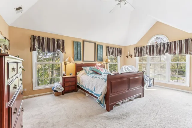 a bed room with a bed and a window