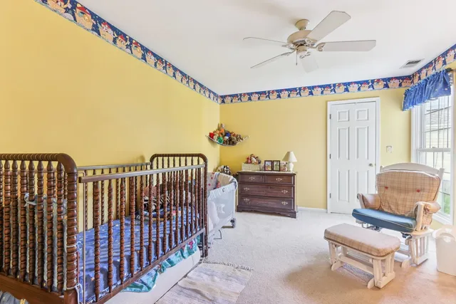a balcony with furniture and a potted plant