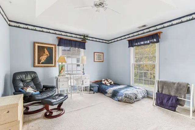 a bedroom with bed and a window