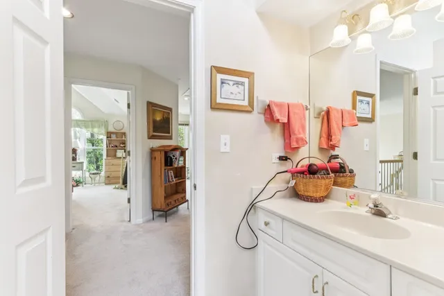 a bathroom with a sink vanity tub and shower