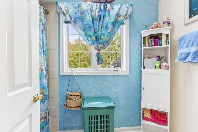 a room with a window and storage