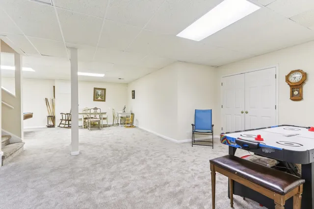 a view of room with furniture and a chandelier