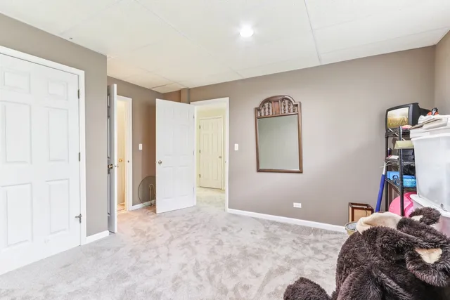 a bathroom with a sink vanity mirror and toilet