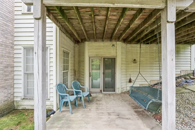 a view of a deck with table and chairs and wooden floor