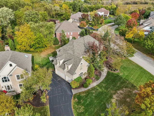 an aerial view of residential building and lake