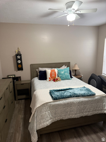 14797 South Chandlerpoint Way Draper, UT 84020 - Photo 21 of 33 Bedroom featuring wood-finish flooring, a ceiling fan with integrated lighting, and a window with blinds