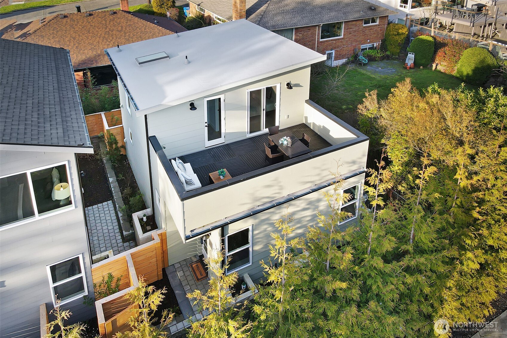 8814 41st Avenue Southwest Seattle, WA 98136 - Photo 1 of 38 an aerial view of a house with a yard