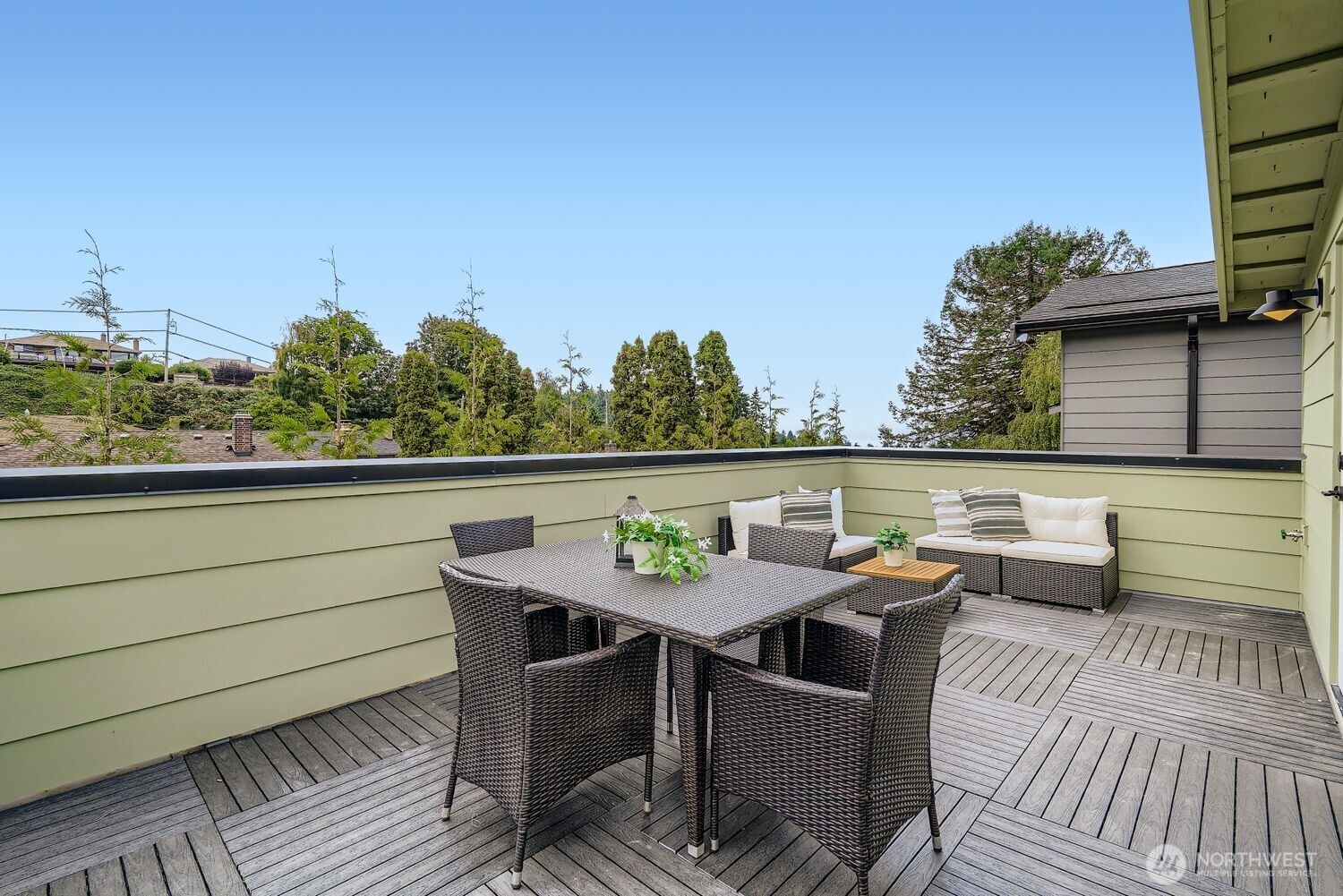 8814 41st Avenue Southwest Seattle, WA 98136 - Photo 22 of 38 a balcony with table and chairs
