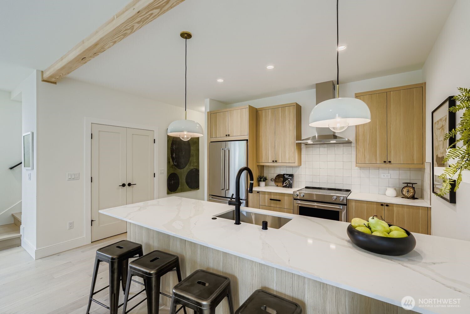 8814 41st Avenue Southwest Seattle, WA 98136 - Photo 10 of 38 a kitchen with a sink a stove and chairs
