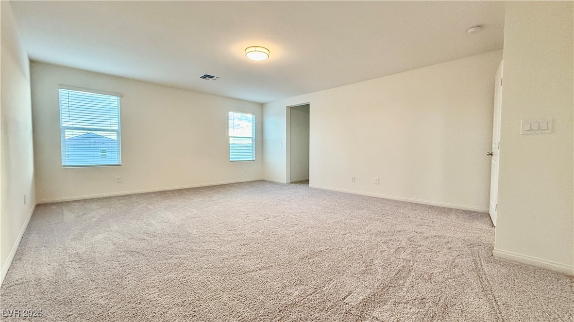 3119 Magnolia Rnch Avenue Las Vegas, NV 89139 - Photo 10 of 17 Spare room with light colored carpet