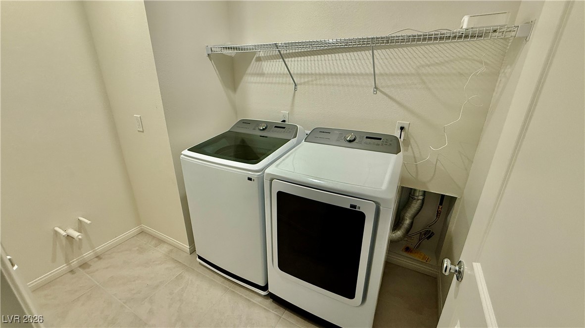 3119 Magnolia Rnch Avenue Las Vegas, NV 89139 - Photo 12 of 17 Laundry area featuring separate washer and dryer and baseboards