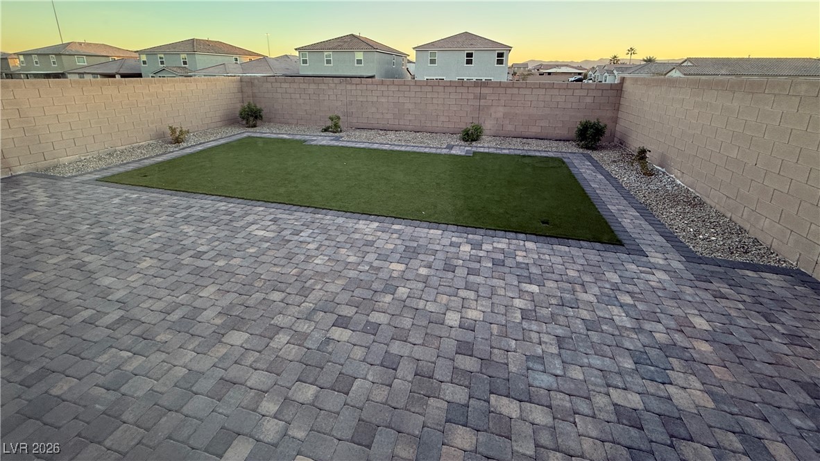 3119 Magnolia Rnch Avenue Las Vegas, NV 89139 - Photo 15 of 17 Fenced backyard featuring a residential view and a patio