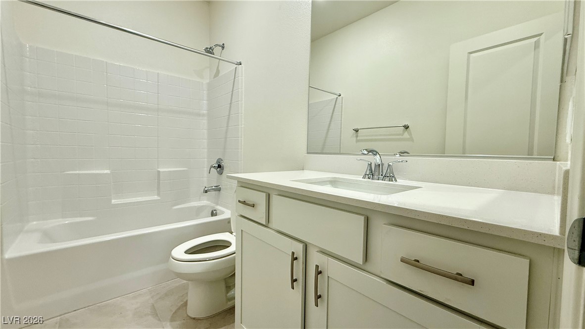 3119 Magnolia Rnch Avenue Las Vegas, NV 89139 - Photo 3 of 17 Full bath featuring vanity, bathtub / shower combination, and light tile patterned flooring