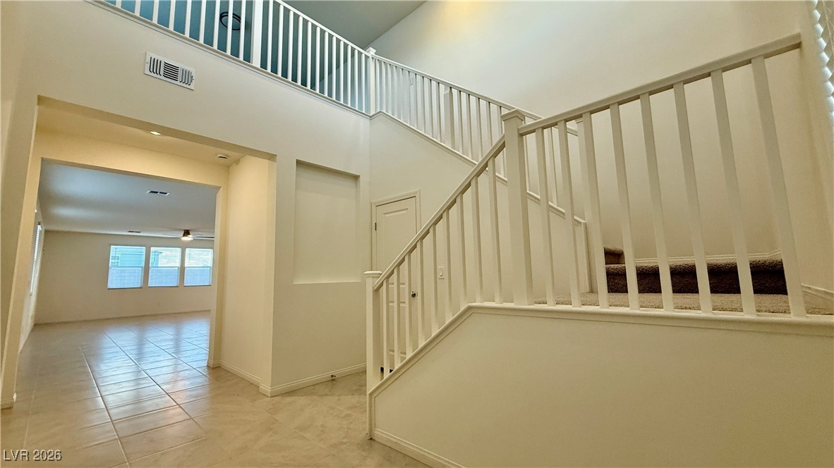 3119 Magnolia Rnch Avenue Las Vegas, NV 89139 - Photo 6 of 17 Stairway featuring tile patterned floors and baseboards